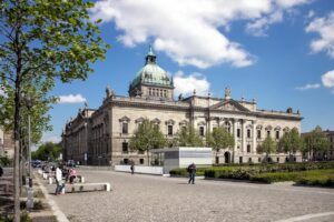 Exterior view of the Federal Administrative Court in Leipzig, Germany with a blue sky.