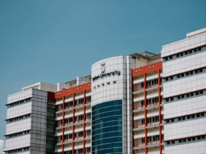 Low angle shot of Telkom University's building facade in Bandung.
