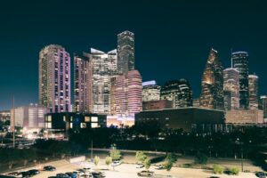 Spectacular night view of the illuminated Houston skyline with modern skyscrapers.
