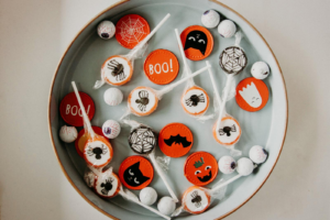 A vibrant assortment of Halloween-themed candies in a bowl, perfect for seasonal celebrations.
