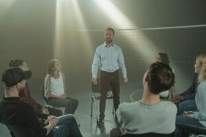 A supportive group therapy session in a sunlit room, highlighting connection and healing.
