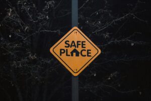 A yellow sign that says safe place on it